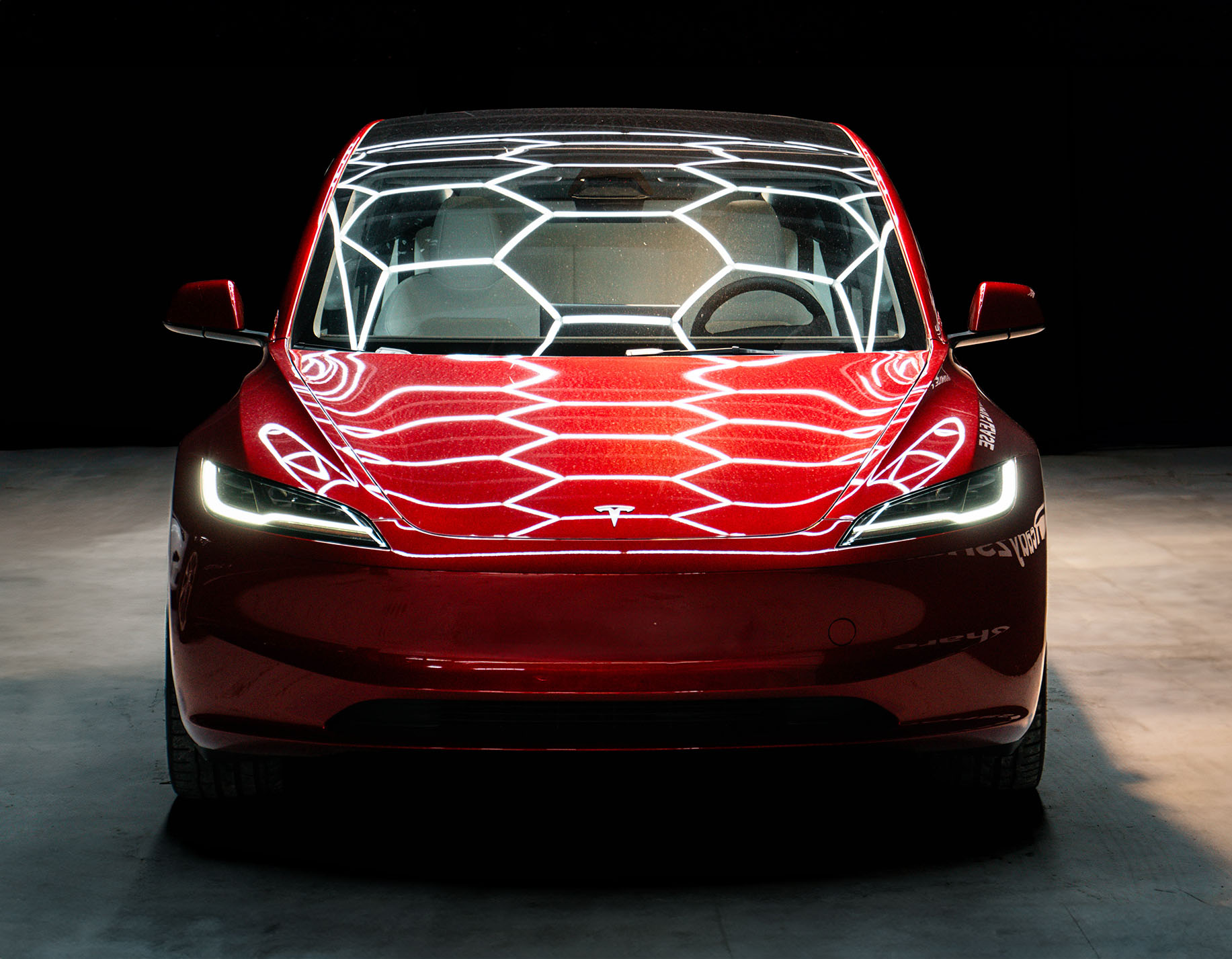 Red Tesla Model 3 Highland Front Bright