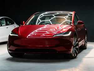 Red Tesla Model 3 Highland Front other side